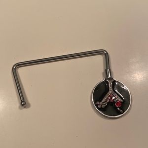 Purse hanger. Great for bars/restaurant to hang purse on your table